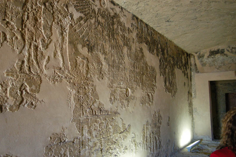 Damaged carvings on the long entrance hall