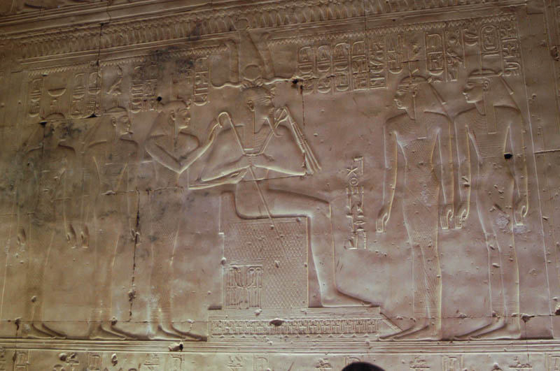 The king in the dress of Amun, receiving blessings