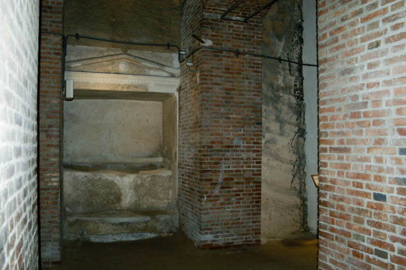the brick-walls surrounding much older niche tombs