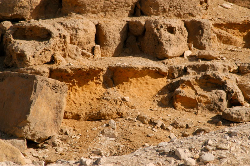 The yellowish interior of the sandstone blocks