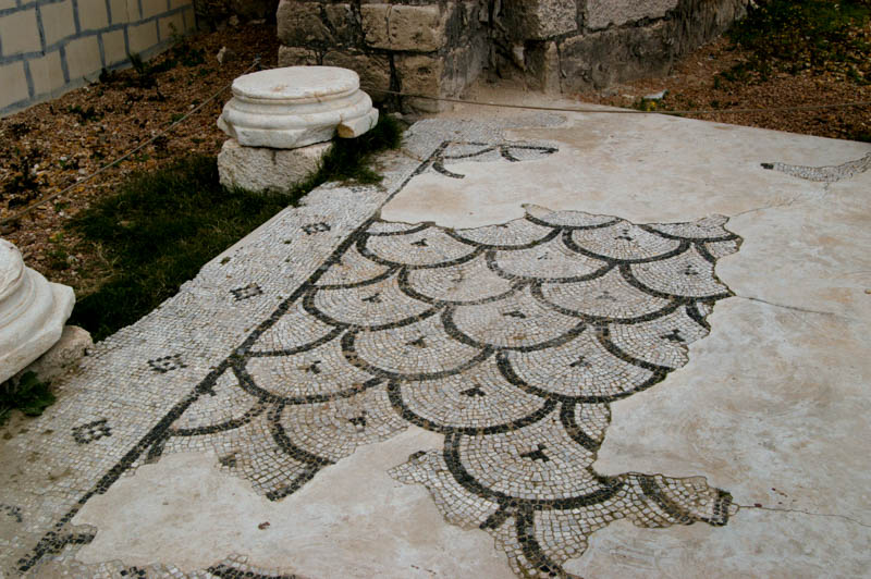original mosaic floor remains in two places on the stage