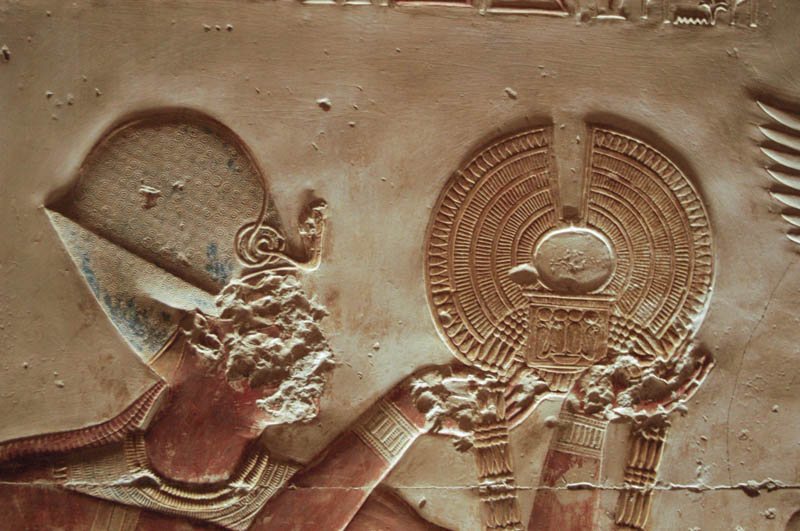 The king Seti in the "war crown", offering a golden collar