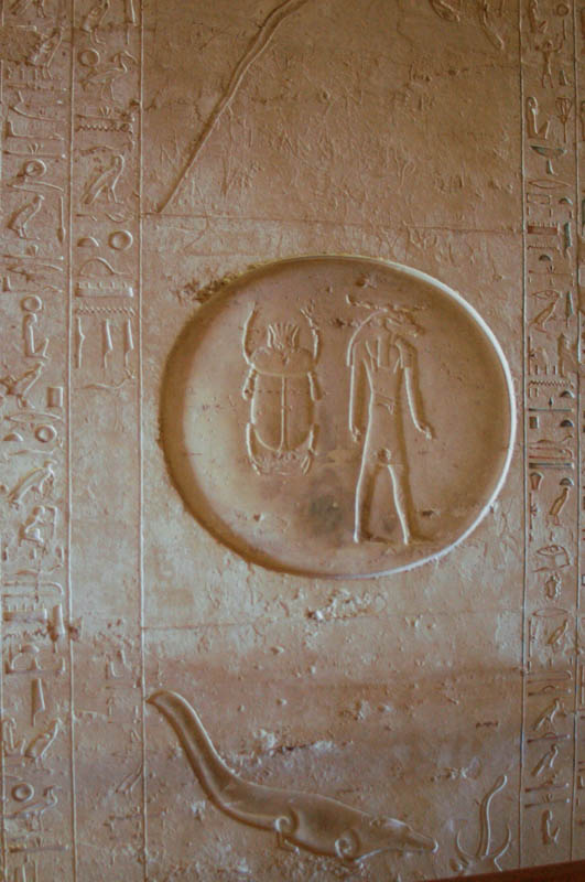 Scarab and crocodile incised deeply into the wall