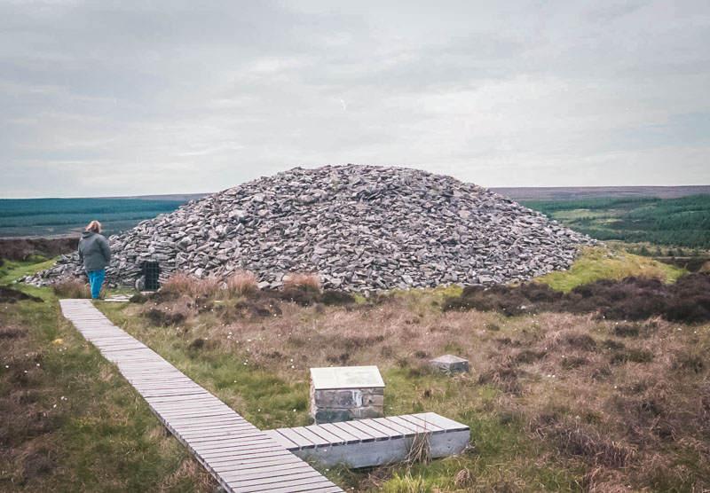 neolithic burial mounds on the moors near caithness, with wooden walkways